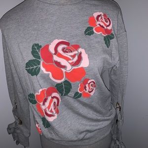 Sweatshirt with floral & ties on sleeve